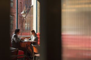 Couple sitting in restaurant booth