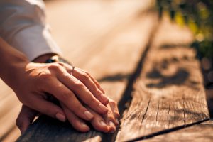 Holding Hands with wedding rings, wedding and engagement background