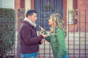 Couple having argument in a hard quarrel outdoors