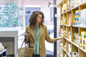 Young woman shopping in a food shop