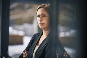 Serious businesswoman at the window