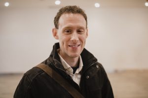 Portrait of a Male Smiling Wearing a Warm Coat