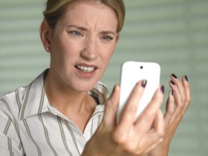 Unhappy woman on smart phone