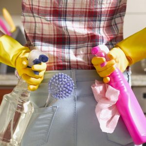 Girl preparing to spring clean kitchen