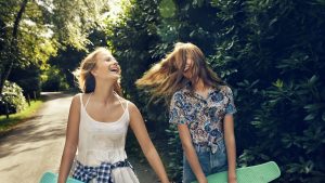 Teenage girls laughing