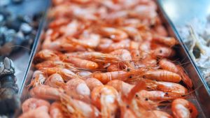 Hot Smoked Prawns . Shrimps On The Showcase In The Market . Pandalus Borealis
