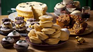 Selection of homemade rustic baked goods such as sweet pies and cupcakes