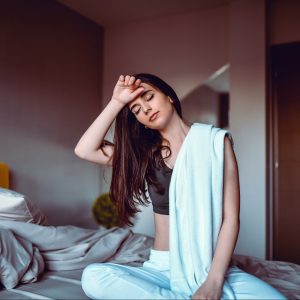 Cute Female Wiping Sweat After Focused Meditation