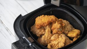 Air fryer machine with chicken
