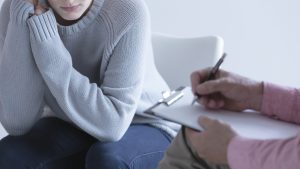 Girl during session with psychotherapist