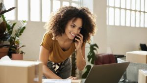 Entrepreneur Using Laptop At Home Office