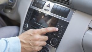 Man playing the music in car
