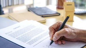 Signing Official Document Or Contract.