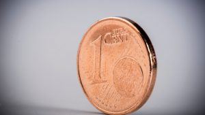 Close-Up Of One Euro Cent On White Table
