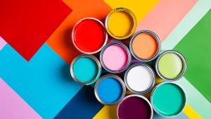 Various bright paints on colorful background