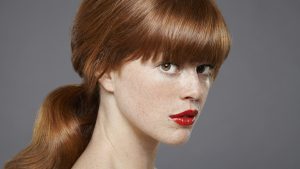 Studio portrait of young woman wearing lipstick