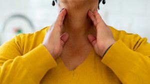 Woman with thyroid gland problem