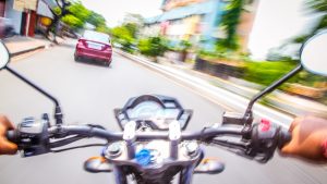 Car chase by bike on street
