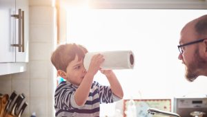 Father and son playing the kitchen
