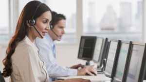 Hispanic businesswoman working on computer