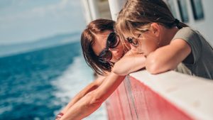 Mother and daughter traveling on a ferry boat