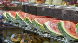 Watermelon, papaya, melon, pineapple grape, fruit on the market shelf.