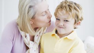 Grandson refusing grandmothers kiss