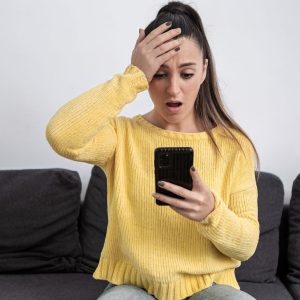 Shocked woman getting scammed on internet