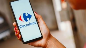 In this photo illustration, the Carrefour logo is displayed