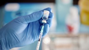 A Healthcare Worker Prepares a Dose of COVID-19 Vaccine.