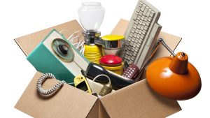Cardboard box with old electrical appliances