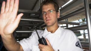 Security Officer Raising Hand