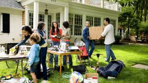 Suburban yard sale, family moving out furniture
