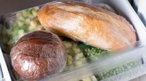 Frozen bread in the home freezer. Long life food storage concept.