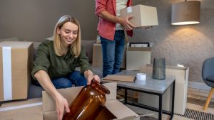 Young family looking involved while packing boxes for the move