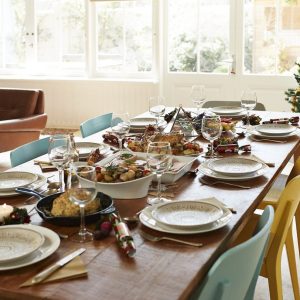 Food with wine served on dining table at home
