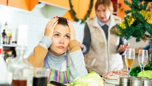 Woman quarreling with daughter during cooking christmas dinner