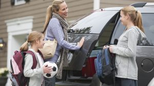 Family getting in van