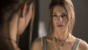 Woman Looking In Mirror