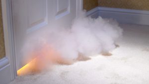 Smoke coming in under door