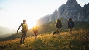 Adventures on the Dolomites: teenagers hiking with dog