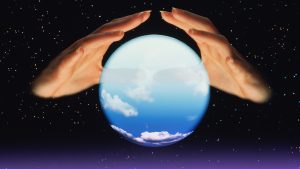Fortune tellers hands and crystal ball