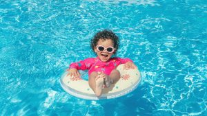 Little girl enjoys the pool
