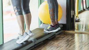 Cropped view of two women doing calf raises