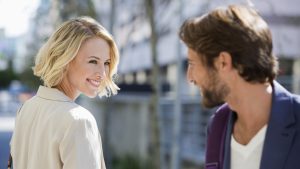 Man and woman smiling at each other