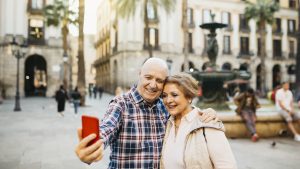 Senior tourist couple taking a selfie