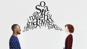 Man and woman with illustrated jumble of letters