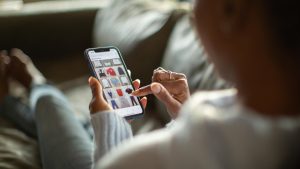 Woman purchasing clothes on a mobile app