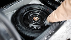 We have a problem here. Spare Tire in Car Trunk