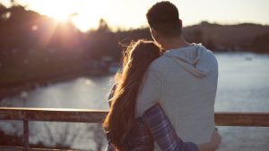 Young couple enjoying sunset